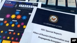 FILE - Pages from the U.S. State Department's Global Engagement Center report on Russian disinformation released on Aug. 5, 2020, are seen in this photo.