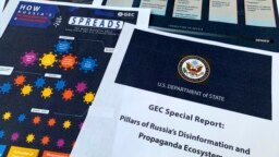 FILE - Pages from the U.S. State Department's Global Engagement Center report on Russian disinformation released on Aug. 5, 2020, are seen in this photo.