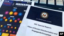 FILE - Pages from the U.S. State Department's Global Engagement Center report on Russian disinformation released on Aug. 5, 2020, are seen in this photo.