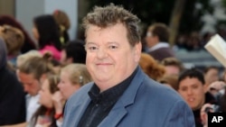 FILE - Robbie Coltrane arrives in London's Trafalgar Square for the world premiere of "Harry Potter and The Deathly Hallows: Part 2," on July 7, 2011. Coltrane, 72, died Oct. 14, 2022, at a hospital in Scotland. 