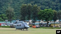 In this photo provided by the Indo-Tibetan Border Police (ITBP), a chopper prepares to take off on a rescue mission at the ITBP helipad in Uttarkashi, in the northern Indian state of Uttarakhand, Oct. 5, 2022.