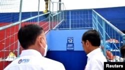 Indonesian President Joko Widodo and Chairman of the Indonesian Football Association Mochamad Iriawan visit to Kanjuruhan Stadium in Malang, East Java province, Indonesia, Oct. 5, 2022. (Indonesia's Presidential Palace/Handout via Reuters) 