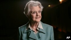 FILE - Angela Lansbury poses for a portrait during press day for "Blithe Spirit" in Los Angeles, Dec. 16, 2014. Lansbury died peacefully at her home in Los Angeles on Tuesday. She was 96. 