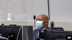 Kenyan lawyer Paul Gicheru appears before a pre-trial chamber, via video from the ICC detention center, before facing charges against him. 