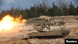U.S. Army M1A1 Abrams tank fires during NATO enhanced Forward Presence battle group military exercise Crystal Arrow 2021 in Adazi, Latvia March 26, 2021