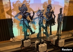 Pertunjukan wayang kulit atau wayang kulit animatronik ditampilkan selama pertunjukannya di George Town, Penang, Malaysia, 2 Oktober 2022. (REUTERS/Ebrahim Harris)
