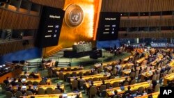 Video monitors show the result of a U.N. General Assembly special emergency session vote in favor of a resolution condemning Russia's illegal referendum in Ukraine, Oct. 12, 2022, at U.N. headquarters.