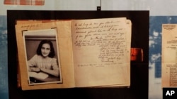 FILE - A photo of Anne Frank is displayed at the opening of the exhibition: "Anne Frank, a History for Today", at the Westerbork Remembrance Centre in Hooghalen, northeast Netherlands, Firday, June 12, 2009.