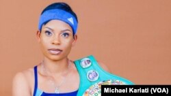 Zimbabwean female boxer Kudakwashe Chiwandikwa defending her WBC belt.