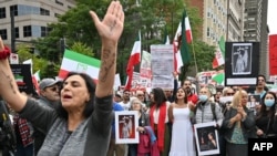 People demonstrate during a protest for Mahsa Amini, who died in custody of Iran's morality police, in Montreal, Quebec, Canada, Oct. 1, 2022.