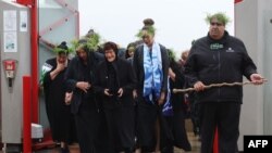 Descendants attend a welcoming ceremony for Maori and Moriori ancestral remains that were returned from the Natural History Museum Vienna at Te Papa, the national museum of New Zealand in Wellington, Oct. 2, 2022.