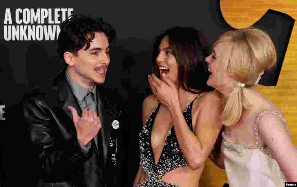 Timothee Chalamet, Monica Barbaro and Elle Fanning attend a premiere of the film "A Complete Unknown" at Dolby Theatre in Los Angeles, California, Dec. 10, 2024.