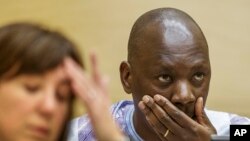 Congolese militia leader Thomas Lubanga who was convicted in March 2012 of recruiting and using child soldiers in 2002 and 2003, waits for the judges to rule on his appeal at the International Criminal Court in The Hague, Dec. 1, 2014.