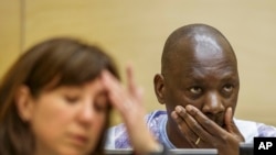 Thomas Lubanga lors de son procès en appel à la Cour pénale internationale de La Haye, le 1er décembre 2014. (AP Photo/Michael Kooren, Pool) 