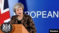 British Prime Minister Theresa May attends a news conference after a European Union leaders summit in Brussels, Belgium, Dec. 14, 2018. 