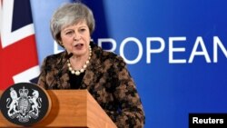 British Prime Minister Theresa May attends a news conference after a European Union leaders summit in Brussels, Belgium, Dec. 14, 2018.