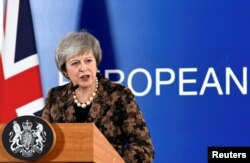 British Prime Minister Theresa May attends a news conference after a European Union leaders summit in Brussels, Belgium, Dec. 14, 2018.