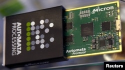 FILE - Memory chip parts of U.S. memory chip maker MicronTechnology are pictured at their booth at an industrial fair in Frankfurt, Germany, July 14, 2015. (REUTERS/Kai Pfaffenbach/File Photo)