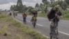 Displaced people who fled clashes between the Congolese army and M23 rebels try to return to their homes in Kibumba, in eastern Democratic Republic of Congo, on June 1, 2022. 