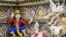 FILE - This July 14, 2020, photo shows the 'One Piece' manga character Monkey D. Luffy among imaginary creatures on the facade of the Wat Pariwat Buddhist temple in Bangkok.