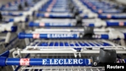 FILE: Shopping carts outside a Leclerc hypermarket in Reze near Nantes in France, April 29, 2020.