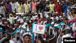 FILE - Muslims rally to condemn a Bharatiya Janata Party (BJP) member for comments about Prophet Mohammad they perceived as insulting, in Kolkata, India, June 14, 2022. In a separate case of alleged blasphemy, the BJP removed one of its social media officials from his post.