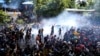 Sri Lankan President Flees, Protesters Storm PM’s Office 