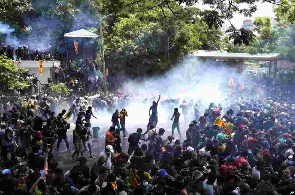 Police use tear gas to break up the protesters who ran toward the compound of Prime Minister Ranil Wickremesinghe&#39;s office, demanding his resignation after President Gotabaya Rajapaksa fled the country amid economic crisis in Colombo, Sri Lanka.