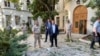 In this handout photo released by Sevastopol governor Mikhail Razvozhaev's Telegram channel July 31, 2022, Razvozhayev, center, stands at the scene of explosion at the headquarters of Russia's Black Sea Fleet in Sevastopol, in Russia-annexed Crimea. 