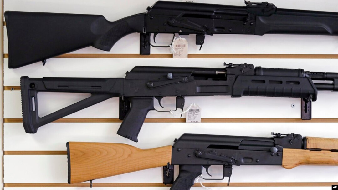 FILE - Semiautomatic rifles are displayed on a wall at a gun shop in Lynnwood, Wash., Oct. 2, 2018. The U.S. House on July 29, 2022, passed legislation that would revive a ban on such weapons. 