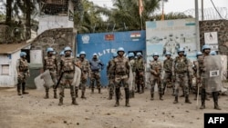 FILE: Soldiers of the U.N. peacekeeping mission MONUSCO take position in front of a U.N. base in Goma, in the North Kivu province of the Democratic Republic of Congo. Taken 7.26.2022