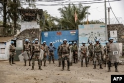 Soldiers of the U.N. peacekeeping mission MONUSCO take position in front of a U.N. base in Goma, in the North Kivu province of the Democratic Republic of Congo, July 26, 2022.