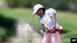 Miroku Suto hits out of a bunker on the 10th hole during the final round at the Junior World Championships golf tournament held at Singing Hills Golf Resort on July 14, 2022, in El Cajon, Calif.