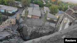 This handout from the State Emergency Service of Ukraine shows a residential building damaged by a Russian military strike, as Russia's attack on Ukraine continues, in the town of Toretsk, Donetsk region, Ukraine July 28, 2022.