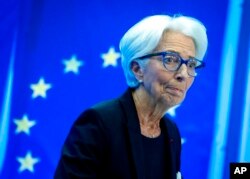 Christine Lagarde, president of the European Central Bank, smiles during a press conference following a meeting of the governing council in Frankfurt, Germany, July 21, 2022.