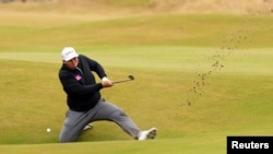 FILE - England's Marcus Armitage plays out of a bunker on the 14th during the second round at the 150th Open Championship, in St Andrews, Scotland on July 15, 2022. (REUTERS/Phil Noble)