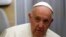 Pope Francis speaks to journalists aboard the papal flight back from Canada, July 30, 2022.