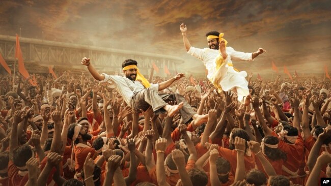 This image released by Netflix shows Ram Charan and N.T. Rama Rao Jr. in a scene from "RRR." (Netflix via AP)