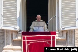 FILE - Pope Francis speaking after the Angelus noon prayer from his studio window overlooking St.Peter's Square, Sunday, July 17, 2022.