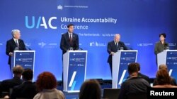 EU Commissioner for Justice Didier Reynders, Minister of Foreign Affairs of the Netherlands Wopke Hoekstra, Prosecutor of the International Criminal Court Karim A.A. Khan QC and Prosecutor General of Ukraine Iryna Venediktova hold a news conference in The Hague, July 14, 2022.