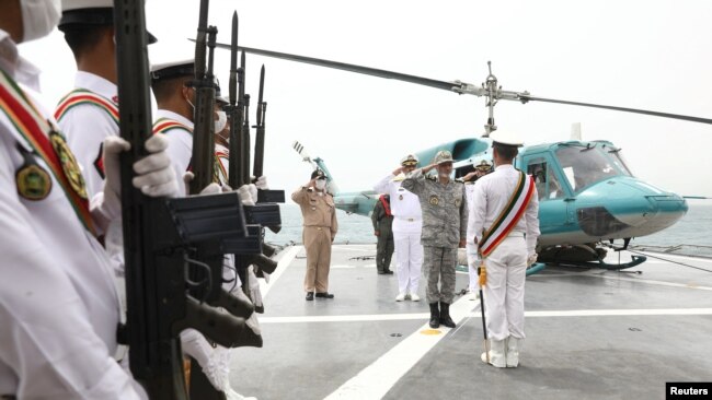 Iran's Army Chief Major General Abdolrahim Mousavi salutes before luanching drones in the Indian ocean, Iran, in this handout image obtained by Reuters on July 15, 2022.