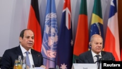 FILE: Egyptian President Abdel Fattah al-Sisi (left) attending the Petersberg Climate Dialogue in Berlin, Germany July 18, 2022 with German Chancellor Olaf Scholz.