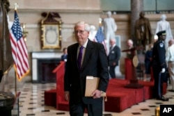 Senate Minority Leader Mitch McConnell heads to the chamber for the final vote on a $280 billion bill designed to boost the U.S. semiconductor industry, at the Capitol in Washington, July 27, 2022.