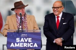 FILE - Attorney John Eastman, left, speaks next to President Donald Trump's personal attorney Rudy Giuliani before Trump's speech to supporters in Washington, Jan. 6, 2021.