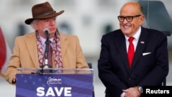 FILE - Attorney John Eastman, left, speaks next to President Donald Trump's personal attorney Rudy Giuliani, before Trump's speech to supporters in Washington, Jan. 6, 2021. 