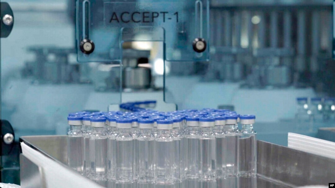 FILE - In this image provided by the Serum Institute of India, vials of freshly manufactured Novavax COVID-19 vaccines wait to be labeled in 2022, in Pune, India. 