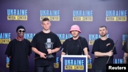 FILE - Kalush Orchestra, the winners of the 2022 Eurovision Song Contest, hold a news conference, amid Russia's invasion of Ukraine, in Lviv, Ukraine, May 17, 2022. 
