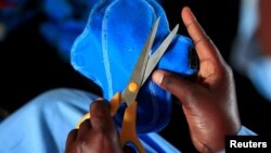 Zimbabwean woman making sanitary pad. (Reuters)