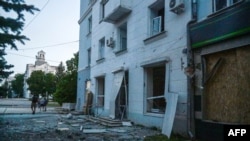 The aftermath of an air strike that hit the Myru (Peace) square in front of the Palace of Culture and Technology and the City Hall in the center of Kramatorsk, Ukraine, on July 15, 2022.