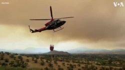 Helicopters Carry Water as Wildfire Rages in Malaga 